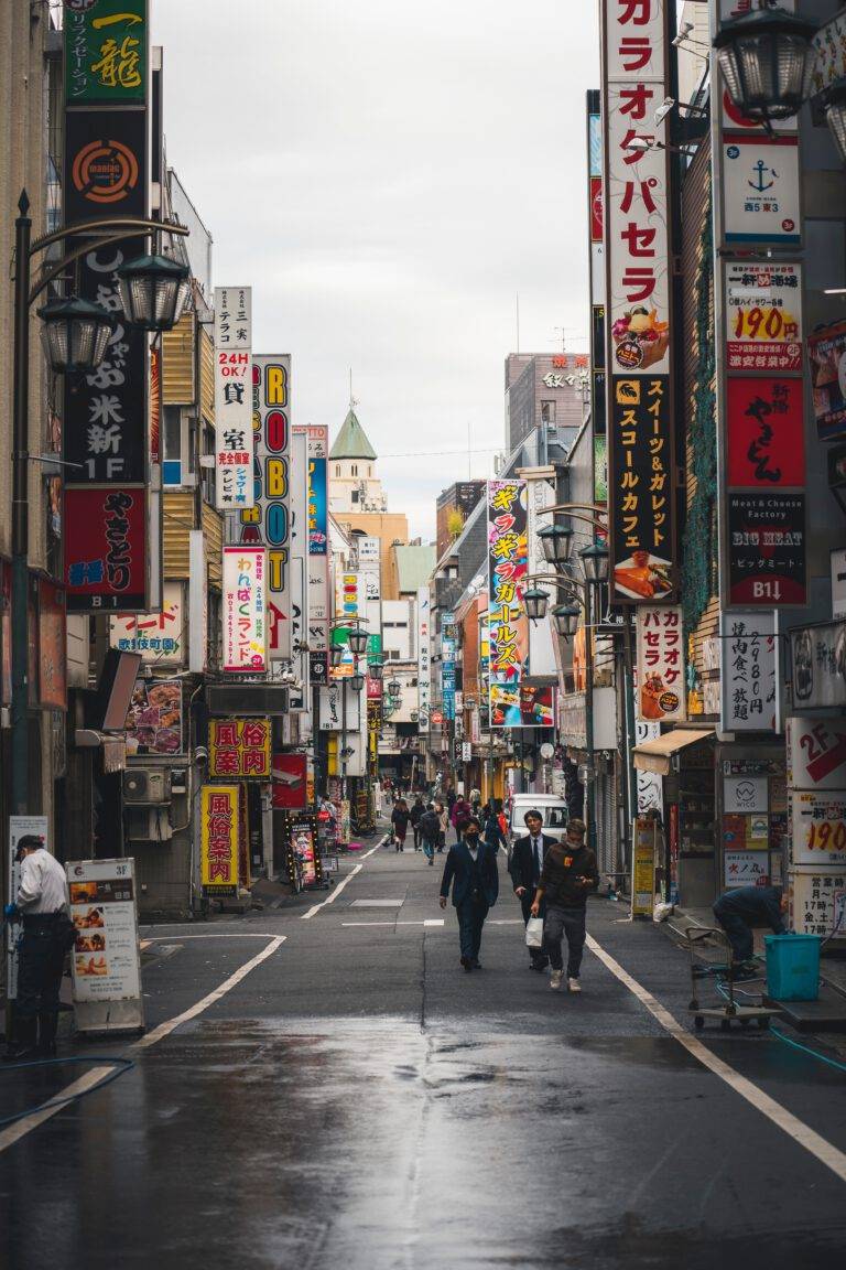 Japanese streets with many advertisements on a rainy day.